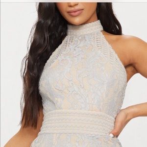 Grey with a slight tint of light blue lace overla.